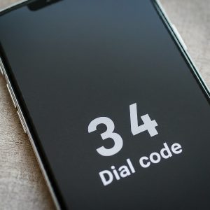 34 dial code